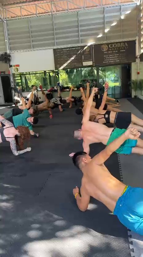 Class floor drills at Cobra Muay Thai