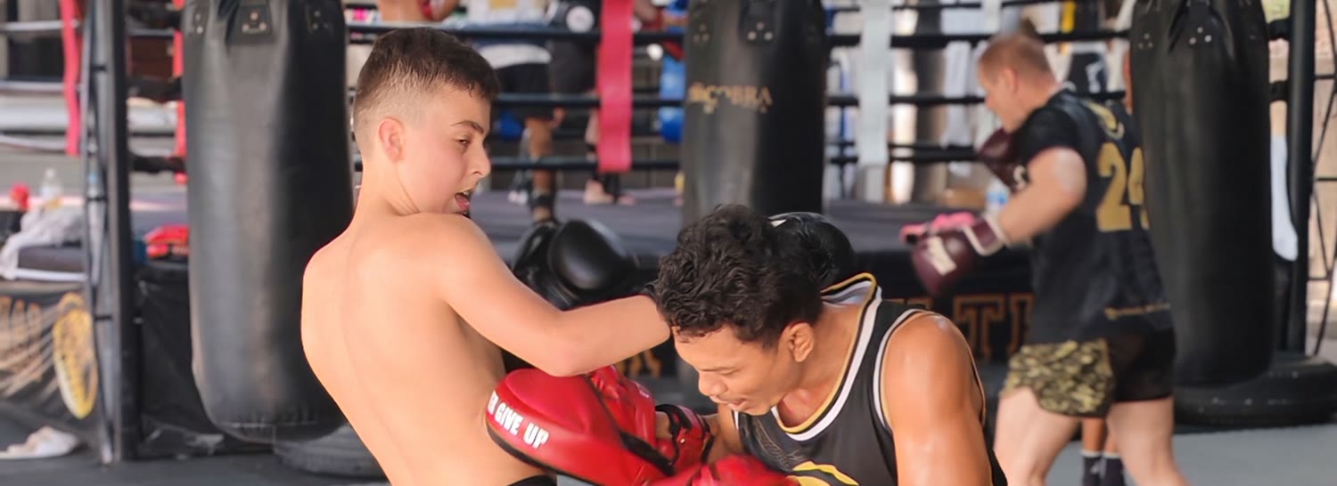 Coach Bow clinch and pad work at Cobra Muay Thai