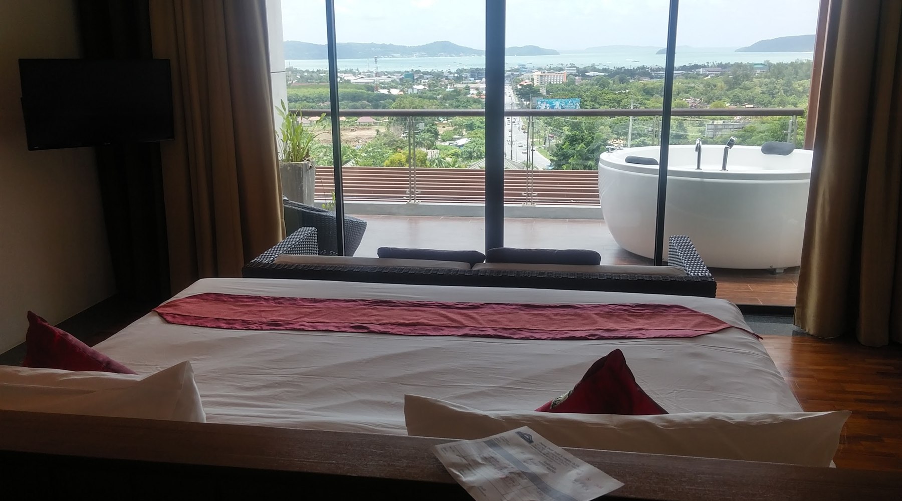 Bedroom view across the balcony bath and bay